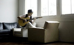 Tom Jordan playing the guitar